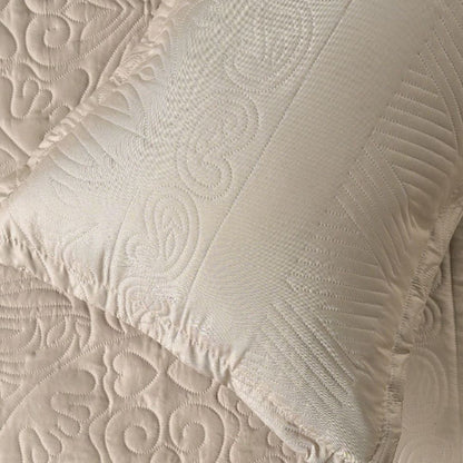 Close-up of textured beige fabric with intricate patterns