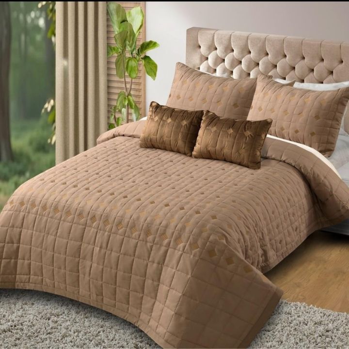 Elegant Persian embroidered quilted bedding set by the brand, showcasing intricate embroidery and plush fabric in a 5-piece bed ensemble.