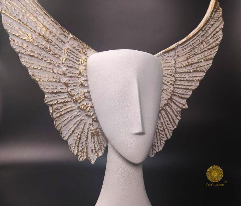 Black Flying Face Statue from The Gharnish abstract figurines collection, featuring a modern, artistic face with wings.