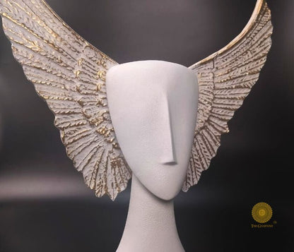 Black Flying Face Statue from The Gharnish abstract figurines collection, featuring a modern, artistic face with wings.