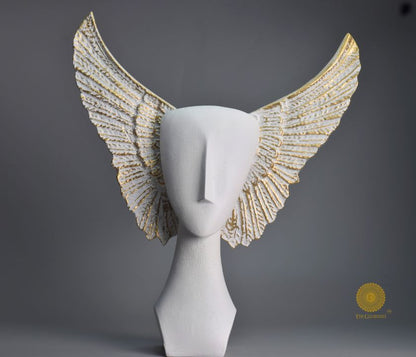 Black Flying Face Statue by The Gharnish, an abstract figurine with a modern, artistic face design on a sleek base.