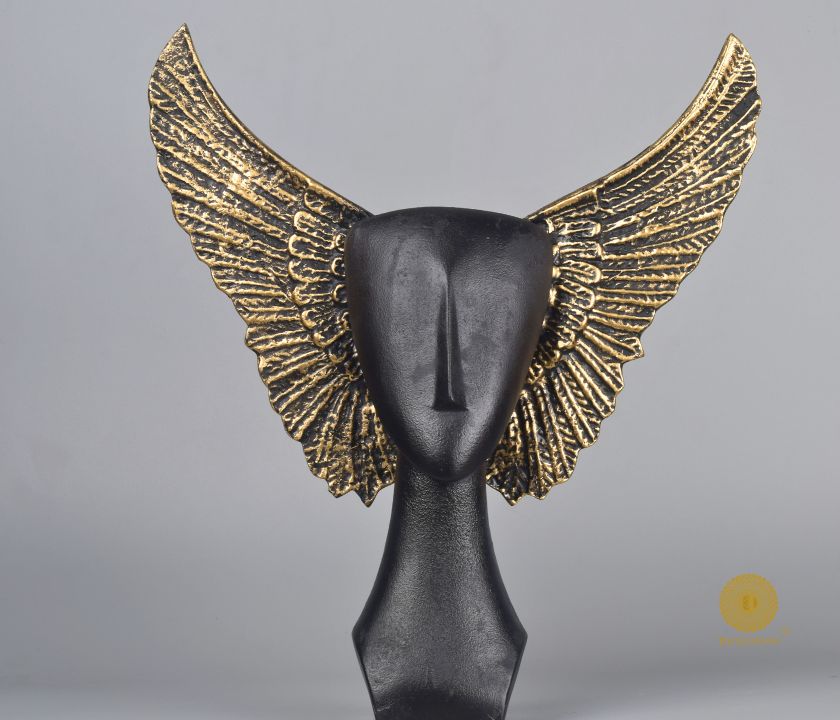 Black Flying Face Statue by The Gharnish, abstract face figurine with a dynamic flying design, crafted by Satkala Creations.
