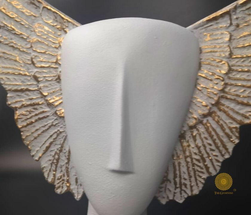 Black Flying Face Statue by The Gharnish, abstract figurine with a modern, artistic design representing a flying face sculpture.