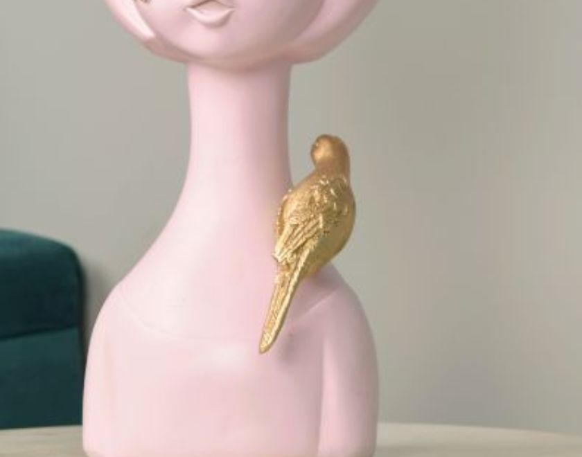 Abstract springtime girl sculpture with sparrow by The Gharnish, featuring pink abstract figurine design and detailed bird element.