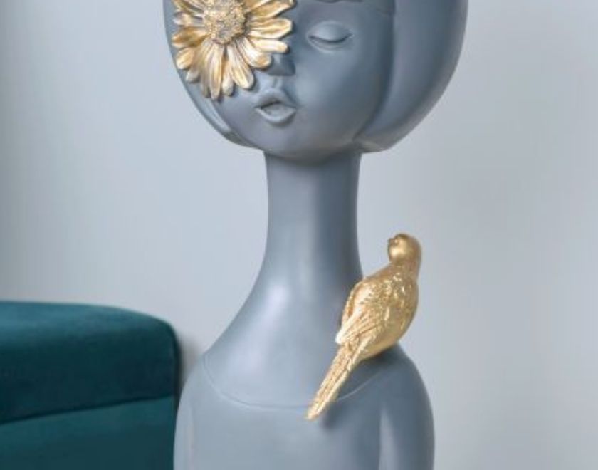 Abstract pink springtime girl sculpture with sparrow, an abstract figurine by The Gharnish, showcasing artistic craftsmanship and design.