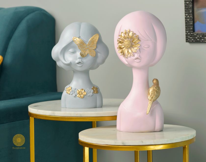 Set of 2 abstract springtime girls statues by The Gharnish, featuring pink and grey figurines with modern, artistic design.