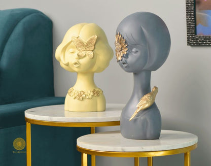 Set of 2 Springtime Girls abstract figurines by The Gharnish, pink and grey decorative statues representing playful girl figures.