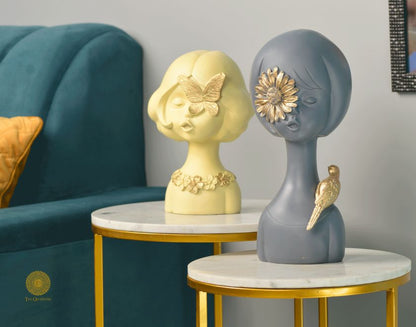 Set of 2 Springtime Girls abstract figurines by The Gharnish, pink and grey decorative statues representing playful girl figures.