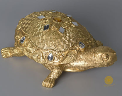 Gold tortoise animal figurine by The Gharnish, a Vastu showpiece, made of metal for decorative and spiritual purposes.