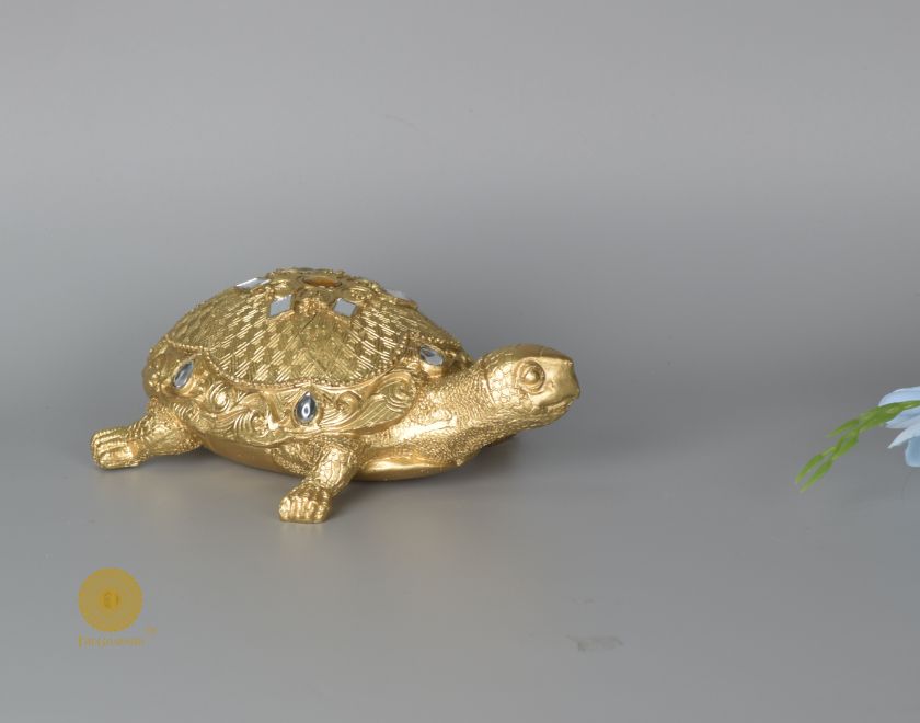 Gold tortoise showpiece from The Gharnish animal figurines collection, designed for Vastu, showcasing a detailed decorative tortoise figure.