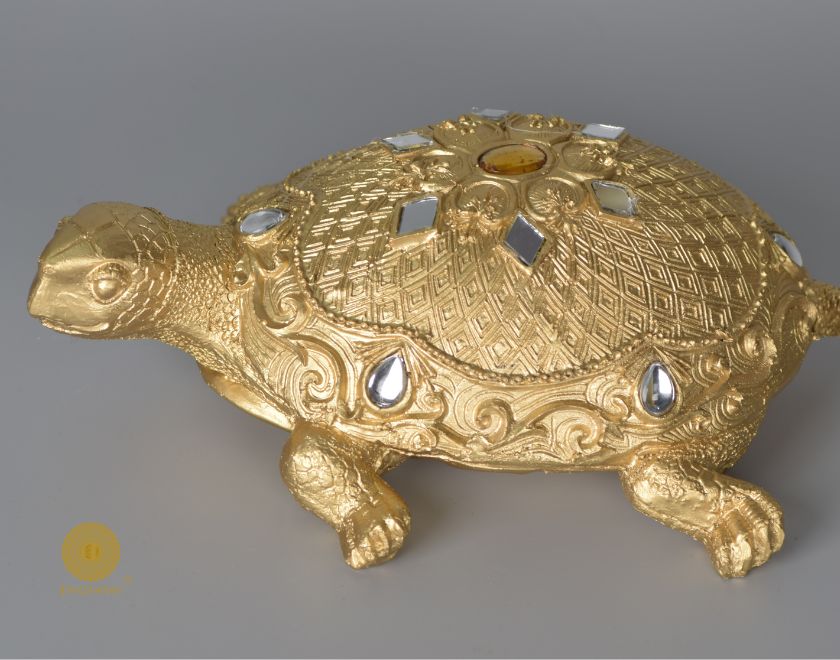 Gold tortoise showpiece from The Gharnish, an animal figurine designed for Vastu, made of decorative material.
