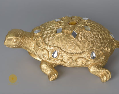 Gold tortoise showpiece from The Gharnish, an animal figurine designed for Vastu, made of decorative material.