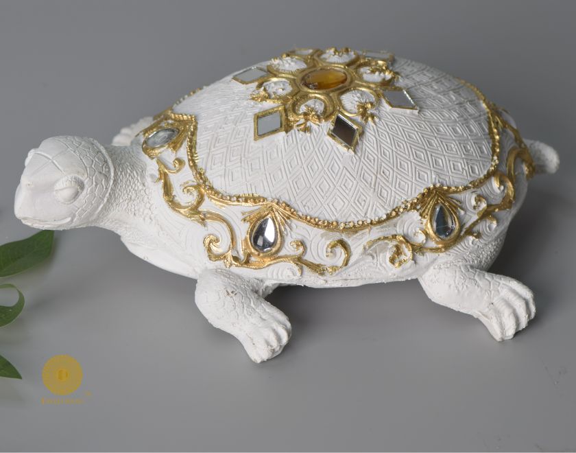 Gold tortoise animal figurine by The Gharnish, a Vastu showpiece symbolizing stability and good fortune.