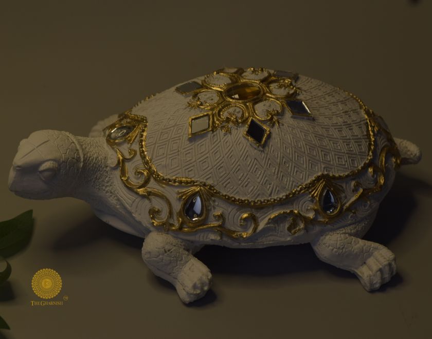 Gold tortoise animal figurine by The Gharnish, perfect as a Vastu showpiece, showcasing intricate craftsmanship and decorative appeal.