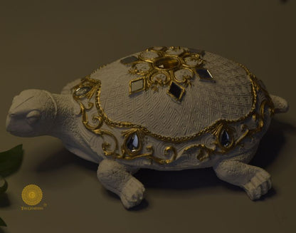 Gold tortoise animal figurine by The Gharnish, perfect as a Vastu showpiece, showcasing intricate craftsmanship and decorative appeal.