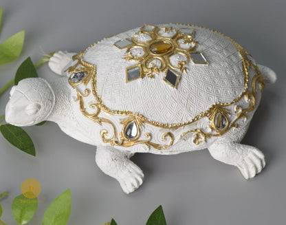 Gold tortoise showpiece from The Gharnish, an animal figurine designed for Vastu, showcasing intricate craftsmanship and elegant detail.