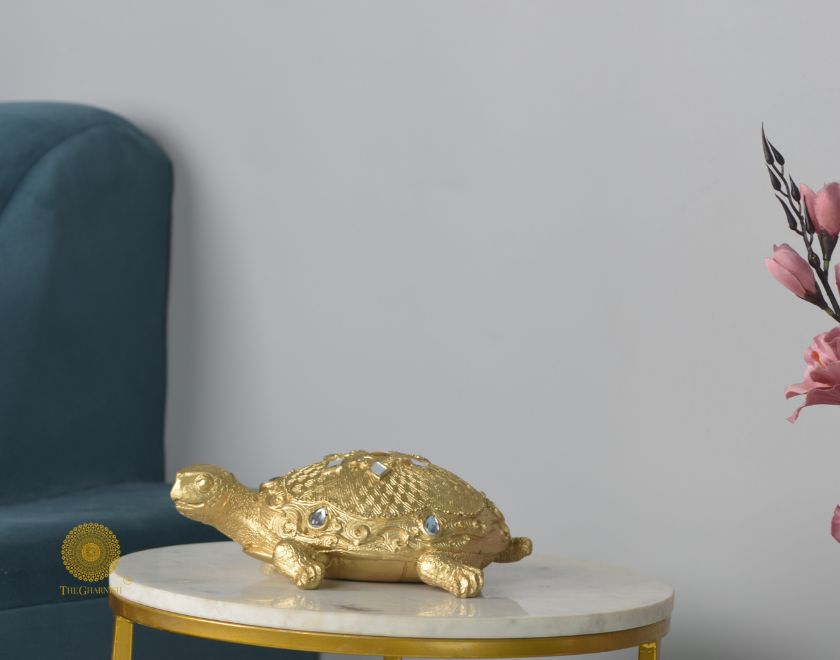 Gold tortoise showpiece, animal figurine for Vastu, crafted by The Gharnish, decorative and symbolic animal sculpture.