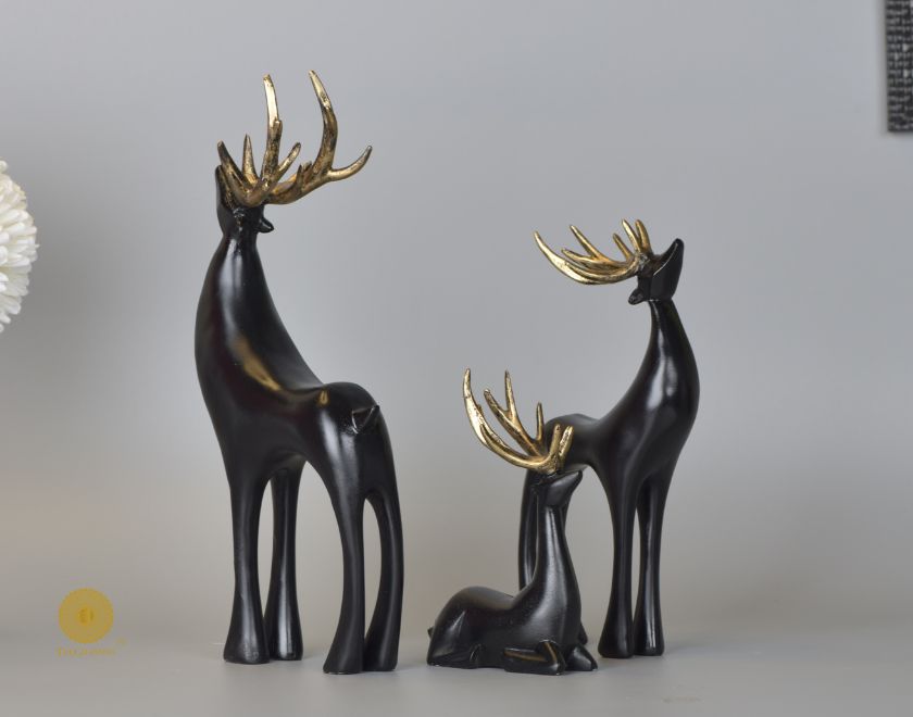 Grey Reindeer Family Figurine by The Gharnish animal figurines, showcasing a detailed reindeer family in a natural pose.