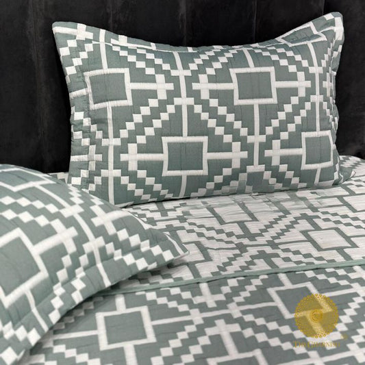 Cally Lilly premium quilted bedding set by The Gharnish featuring floral patterns and soft, comfortable fabric for a stylish bedroom.