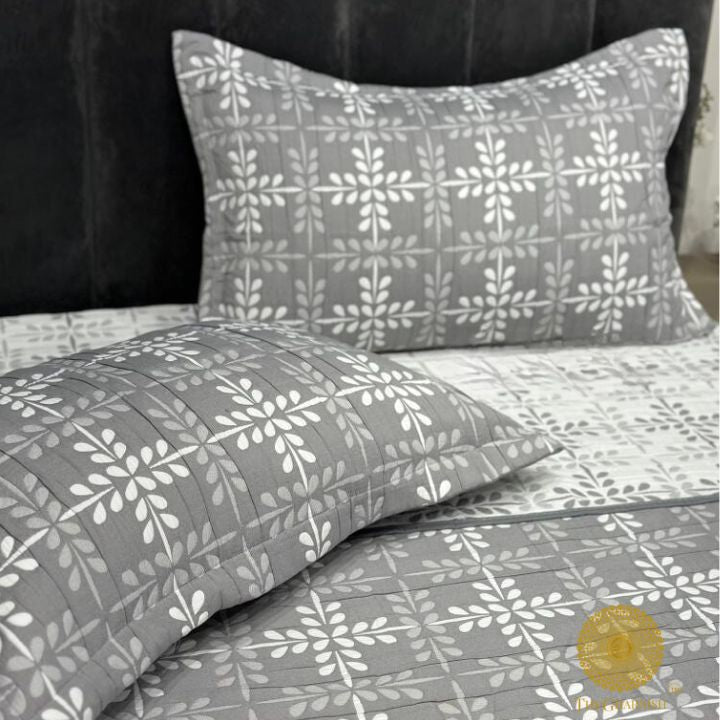 Cally Lilly Premium Quilted Bedding Set by The Gharnish featuring floral patterns and plush quilting for a cozy bedroom look.