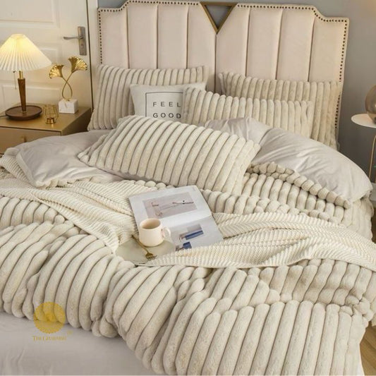 Luxurious rabbit fur bedding set from The Gharnish designer collection, featuring four cozy winter bedding pieces.