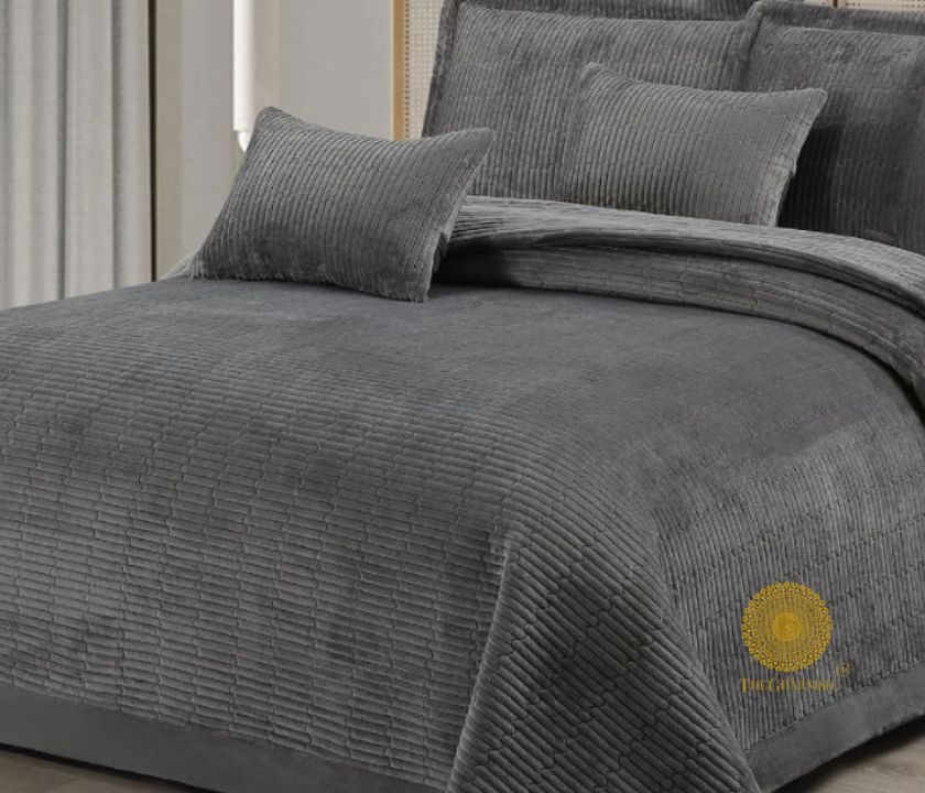 Luxury quilted bedding set by The Gharnish, 5-piece designer collection with elegant patterned bedcover and matching pillowcases.