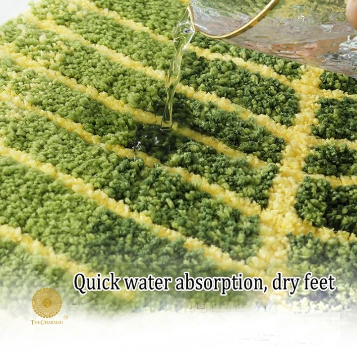 Banana leaf-shaped shaded doormat by The Gharnish, 16x32-inch carpet for entryway or bathroom decor.