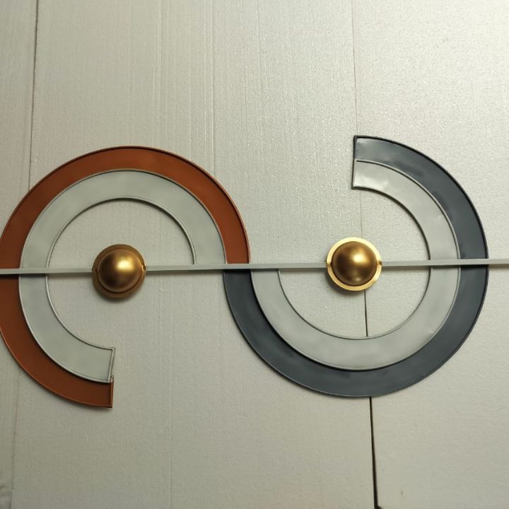 Abstract iron wall art by The Gharnish features intricate metal designs, perfect for modern home decor.