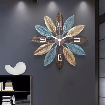 Modern Roman leaf design wall clock by The Gharnish, 30 inches, featuring elegant Roman numerals and leaf-inspired accents.