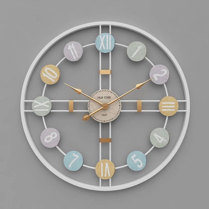 Metallic Roman numeric wall clock by The Gharnish, 24-inch diameter, stylish wall clock with bold Roman numerals.