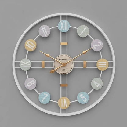 Metallic Roman numeric wall clock by The Gharnish, 24-inch diameter, stylish wall clock with bold Roman numerals.