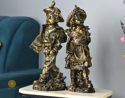 Gold antique abstract walking couple figurines by The Gharnish, 5x15 inches each, featuring elegant, artistic design in a walking pose.