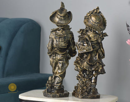 Antique gold abstract walking couple figurines by The Gharnish, 5x15 inches each, featuring elegant, artistic design.