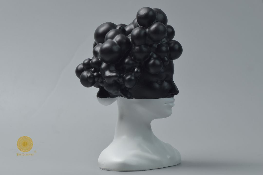 Black modern stylish lady face statue from The Gharnish, an abstract figurine with sleek, contemporary design.
