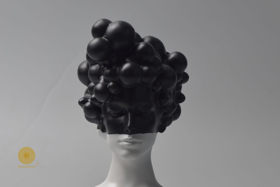 Black modern abstract lady face statue by The Gharnish, stylish and contemporary figurine with elegant facial features.