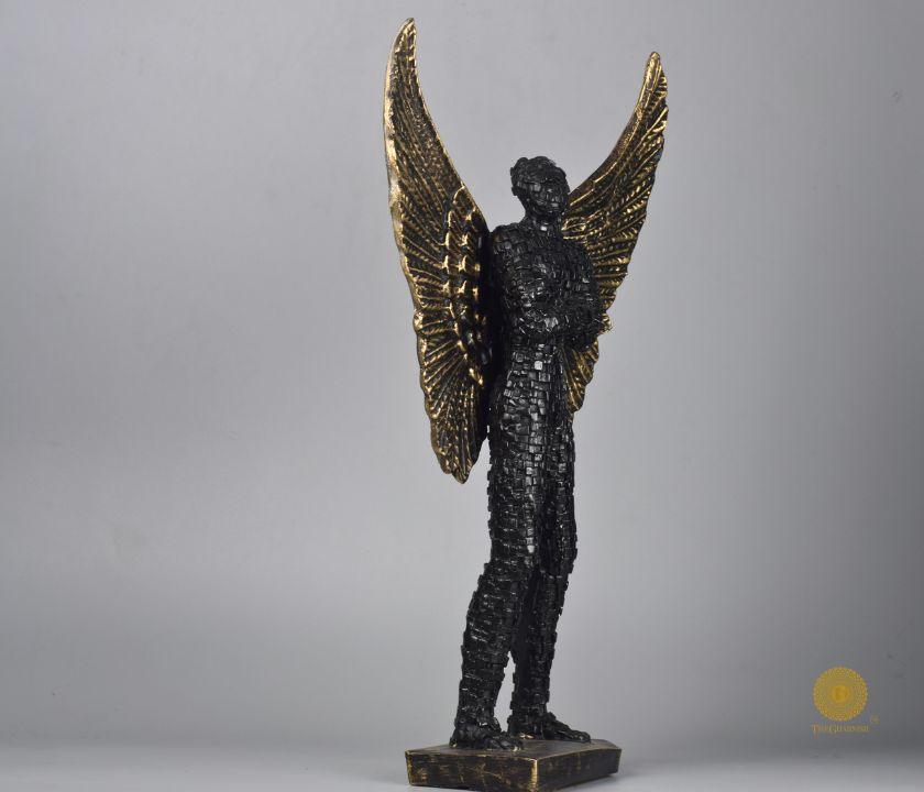Abstract figurine of a man with wings by The Gharnish, limited edition Flying Wings Man statue displayed on a pedestal.