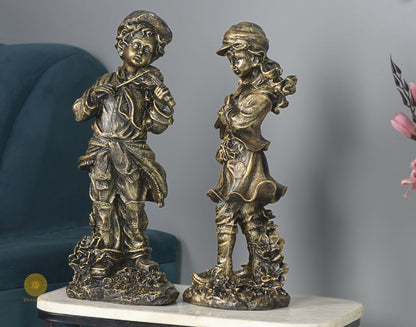 Abstract musical couple statue by The Gharnish, showcasing elegant antique-style figurines in a detailed, artistic design.