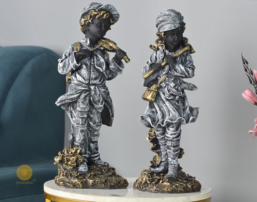 Abstract musical couple statue by The Gharnish, featuring elegant antique-style figurines in a stunning artistic design.