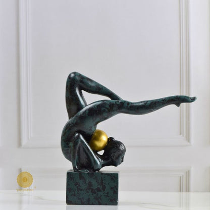 Ancient Gold Acribat Gymnast figurine from The Gharnish, an abstract sculpture of a gymnast in dynamic pose on a gold finish.