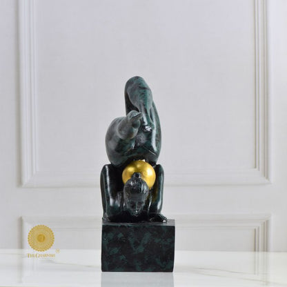 Ancient Gold Acribat gymnast figurine by The Gharnish, abstract gold sculpture capturing dynamic movement and artistic design.