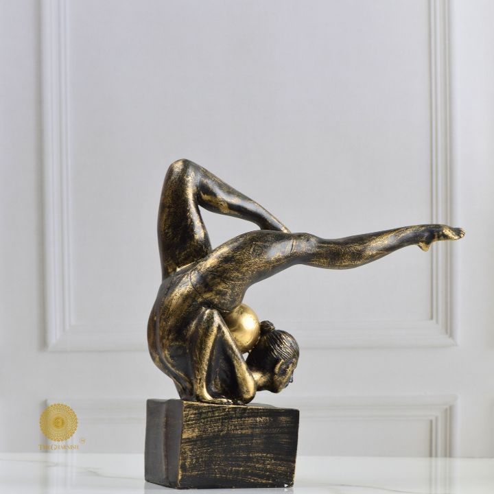 Ancient Gold Acribat Gymnast figurine by The Gharnish, an abstract gold sculpture of a gymnast in dynamic pose.