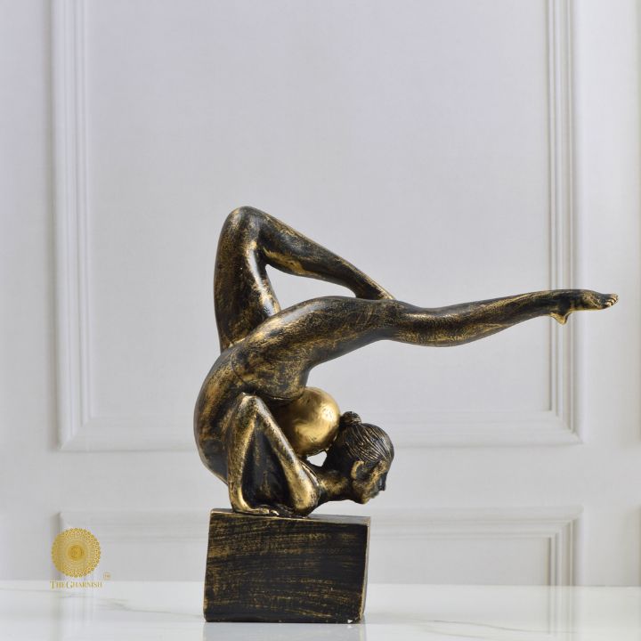 Ancient Gold Acribat Gymnast Figurine by The Gharnish, abstract sculpture depicting a gymnast in dynamic pose.