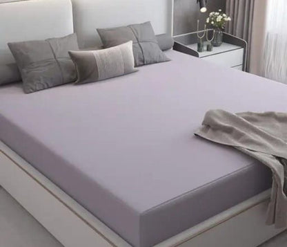 Premium quality Terry cotton waterproof mattress protector from The Gharnish, showing soft terry fabric and waterproof layer.
