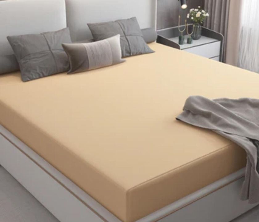 Premium quality Terry cotton waterproof mattress protector by The Gharnish, showing soft terry fabric and waterproof layer.