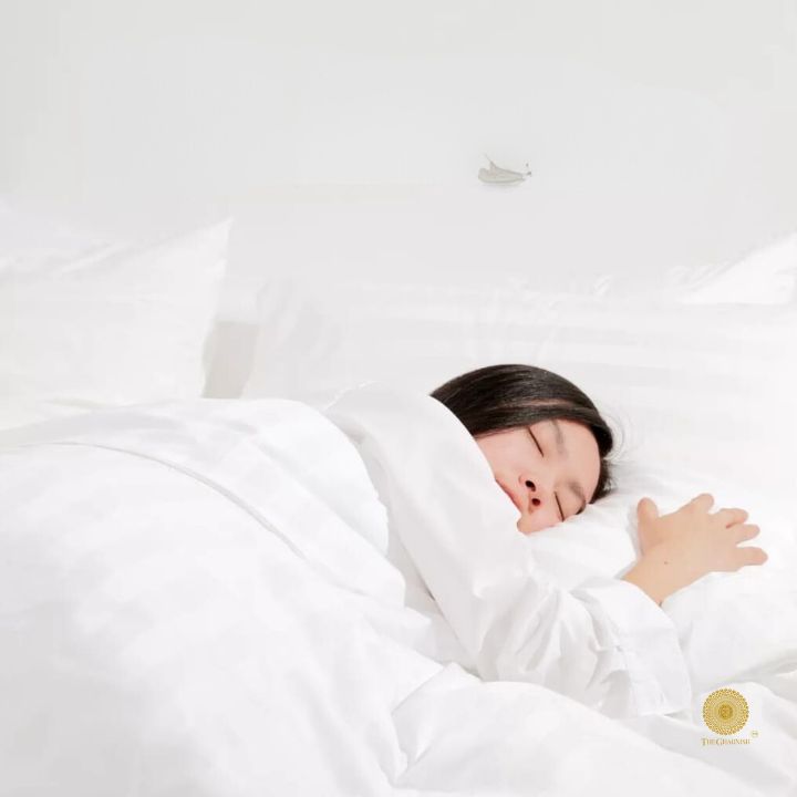 Cream and gray striped bedding comforter by The Gharnish, showcasing a soft, plush fabric with a stylish, modern design.