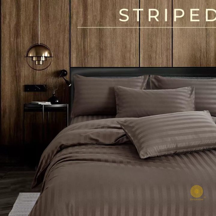 Close-up of The Gharnish Premium Stripe Comforter with soft bedding fabric and vibrant stripe pattern, showcasing cozy bedding comfort.