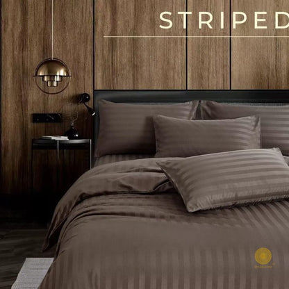 Close-up of The Gharnish Premium Stripe Comforter with soft bedding fabric and vibrant stripe pattern, showcasing cozy bedding comfort.