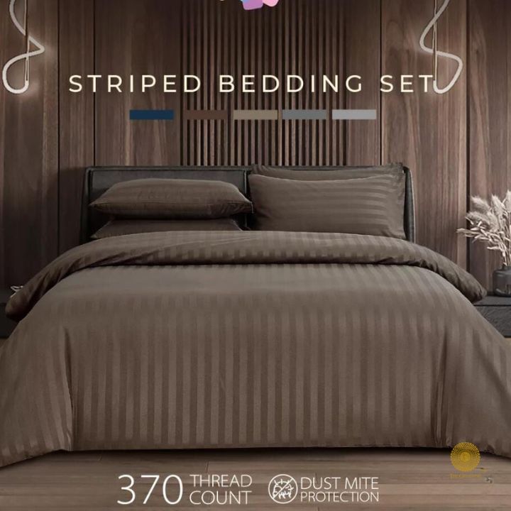 Premium stripe comforter from The Gharnish, showcasing soft bedding with a stylish striped pattern and quilted texture.