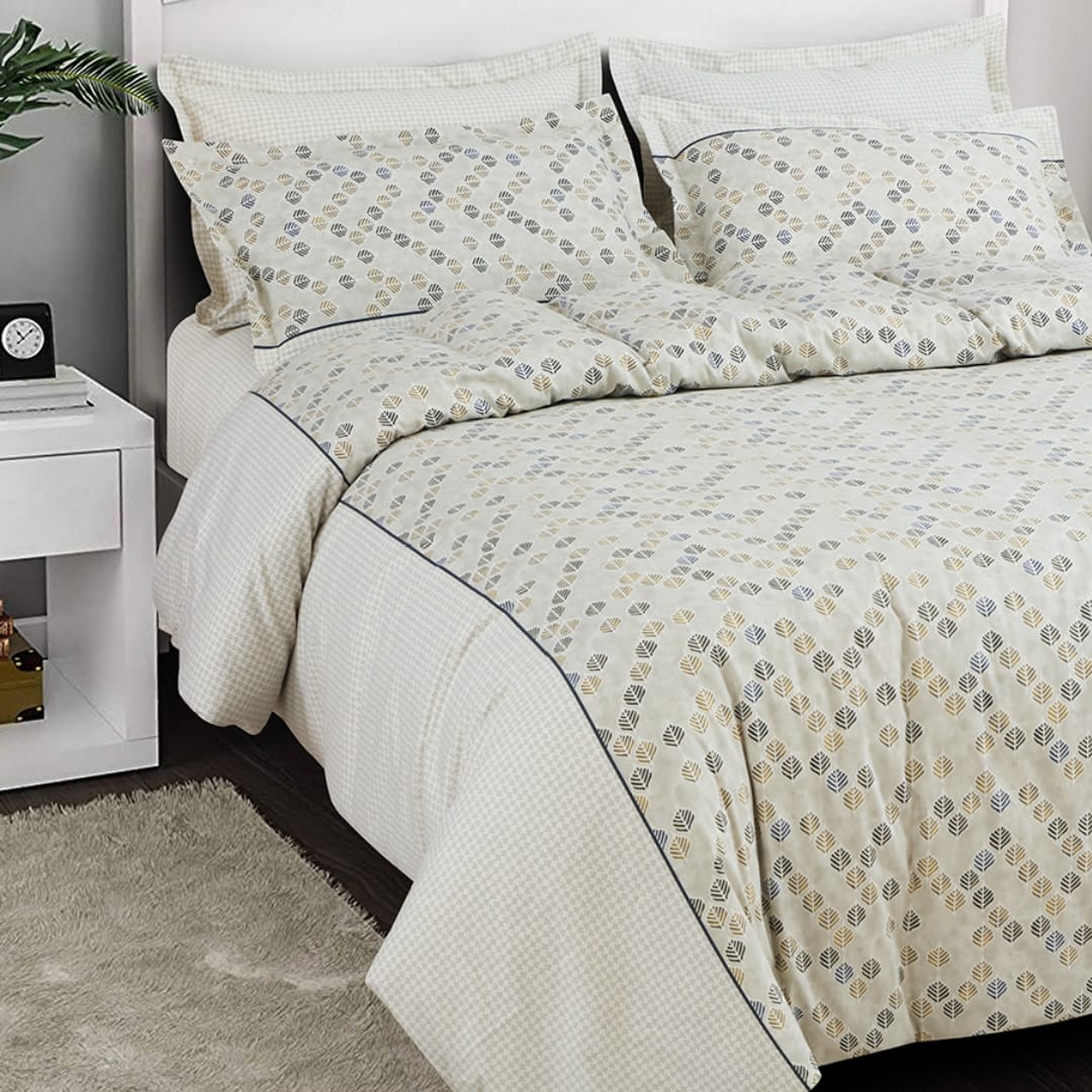 Pure white cotton bedding set from The Gharnish with vintage floral pattern on bedsheet and pillowcases.