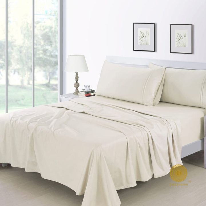 Organic cotton bedsheet from The Gharnish with 300 thread count, featuring a soft, smooth bedding fabric in a neutral color.